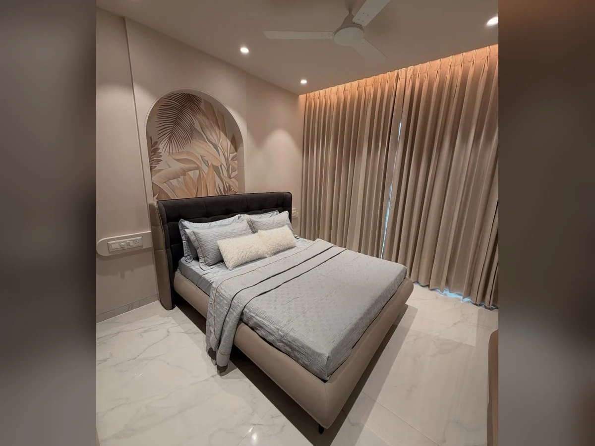 Bedroom Interior – Upholstered Bed and Feature Wall, completed project photograph by Royal Contractor