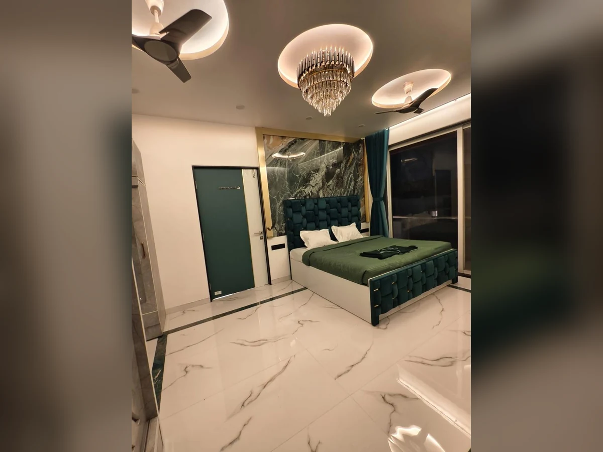 Bedroom – Green Upholstered Bed and Feature Wall, completed project photograph by Royal Contractor
